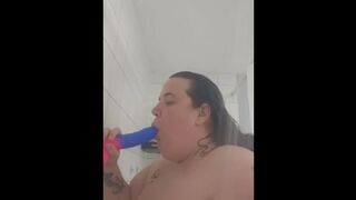 Sucking dildo in shower